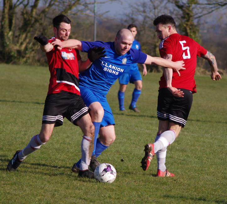 Monkton Swifts James Russell competes strongly with Clarby Road player manager Matthew Ellis